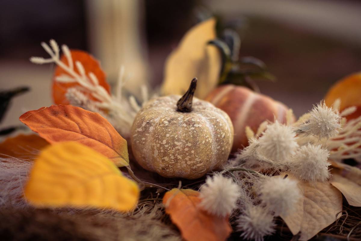 thanksgiving home decor diy featuring repurposed household items and foraged branches creating a warm, authentic tablescape